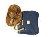 a baseball mitt and a bag of luggage on a white background