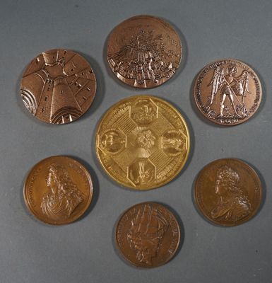 several coins are arranged in a circle on a gray surface
