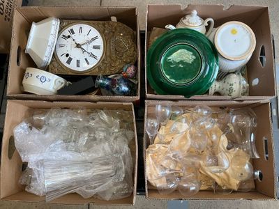 three boxes with different items in them sitting on the floor