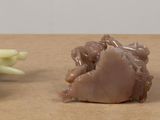 three different types of rocks on a wooden table