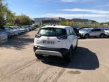 a white car that is parked in a parking lot