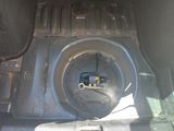 a close up of the inside of a vehicle ' s trunk