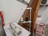 a sewing machine sitting on a table in a room