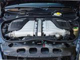 a picture of a car engine with its hood open