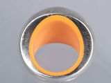an image of a ring with an orange center on a white surface