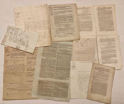 several pages of old papers are laying on a white surface