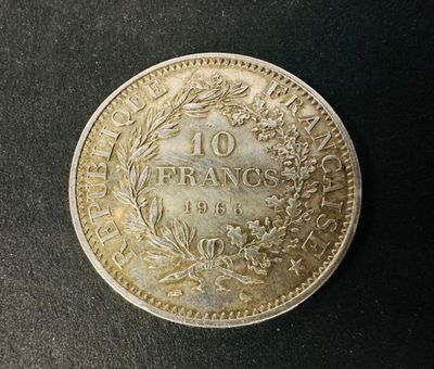 a close up of a coin on a black surface