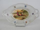 a plate with a picture of a bird and a bird on it