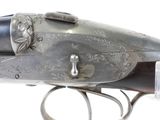 an old gun with a silver body and a silver handle