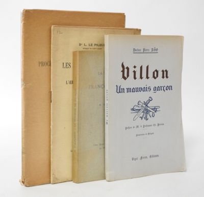 three books sitting on top of each other on a white surface