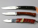 three different types of knives that are on a table