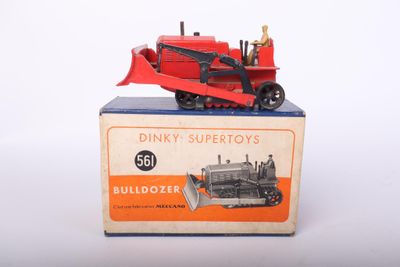 a toy tractor that is sitting on top of a box