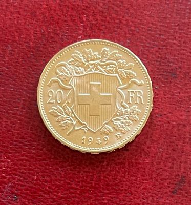 l'image d'une pièce d'or sur laquelle figurent des armoiries