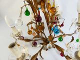 a chandelier with a bunch of glass ornaments hanging from it