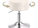 une image représentant un tabouret blanc avec un piètement en métal