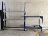 a blue cart that is next to a white brick wall