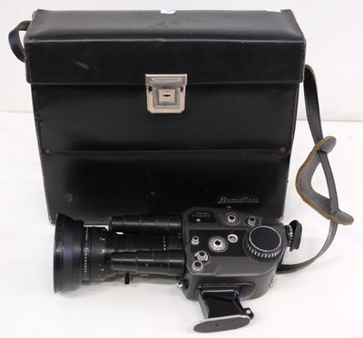 a camera and a case sitting on a white surface