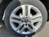 a close up of a tire on a car ' s rim