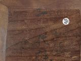 a wooden box with a clock on top of it