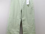 a close up of a pair of green pants on a hanger