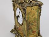a small clock that is sitting on a table