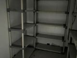 a room with a bunch of shelves in it