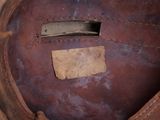 a close up of a brown shoe with a label on it