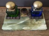 two bottles of perfume sitting on top of a table