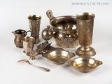 a lot of silver items that are sitting on a table