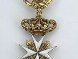 a close up of a medal on a white surface