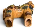 a small piece of pottery that looks like a horse