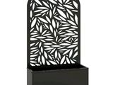 a black metal planter with a leaf design on it
