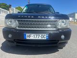 a black range rover parked on the side of the road