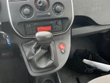 a dashboard of a small car with a steering control