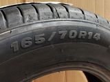 a close up of a tire on a cardboard box with a box in the background