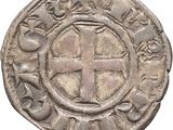 an old silver coin with a cross on it