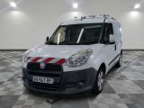 a white van with red stripes parked in a room