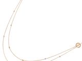 a gold chain necklace with a circular design on a white background