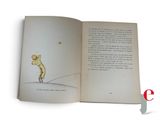 an open book with a picture of a man holding a star