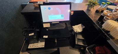 a computer sitting on top of a desk in a room