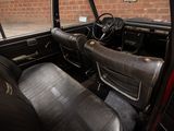 a black leather seat in the back of a red car