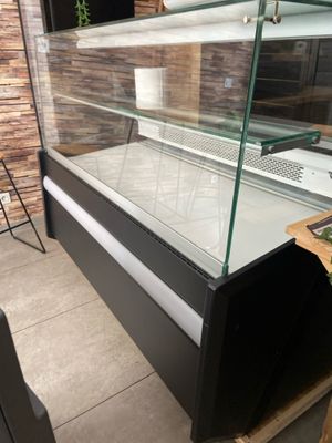 a display case with a glass top in a store