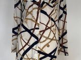 an image of a mannequin dress with chains on it