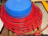a stack of red and blue plastic bowls on a pallet