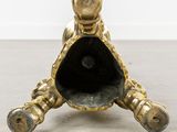 an antique brass figurine of a turtle on a marble base