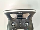 a close up of a remote control on a white surface