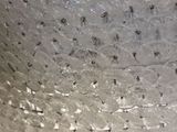 a close up of a glass bowl with a lot of water on it