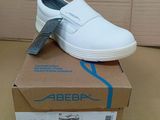 a white shoe that is on top of a box