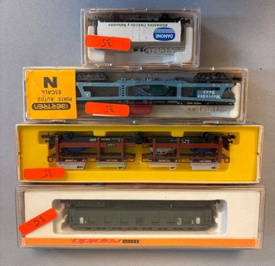 three train cars that are sitting on top of each other