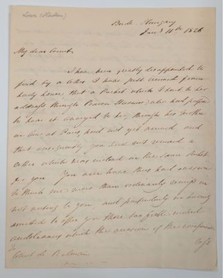 lettre manuscrite écrite à l'encre noire sur une feuille de papier